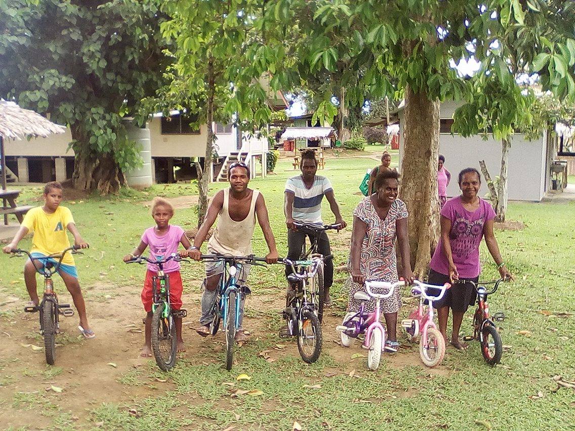 Some happy recipients of the bikes that were taken over in the container