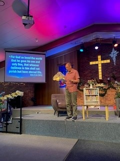 Pastor Tony speaking at Community Carols Night December 2023